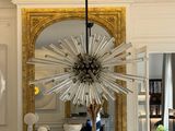 a dining room with a fireplace and a chandelier in it