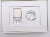 a white box with a charger and a plug attached to it