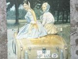 a picture of two women riding in a car