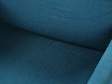 the back of a blue chair with a black seat and arm rest