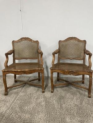 pair of antique oak chairs with cane back and cane arms