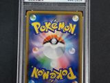 a close up of a pokemon card in a plastic holder