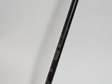 a close up of a metal pole with a black handle