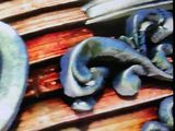 a picture of a close up of a clock on a bench