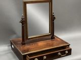 an antique wooden dressing table with a mirror on top
