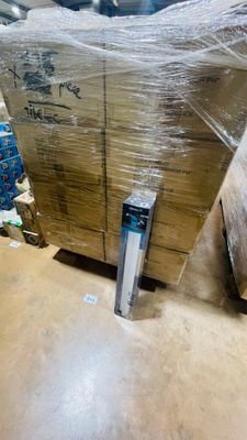 a large pile of boxes sitting on the floor in a warehouse
