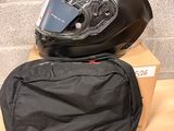a helmet and a bag sitting on a table