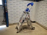 a picture of a ladder in a building with a wall behind it
