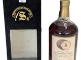 an image of a bottle of whisky sitting next to a box