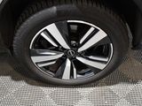 a close up of a tire on a car ' s rim