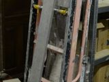 a ladder that is leaning against a wall in a room