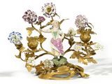 an image of a figurine of a woman with flowers on a stand