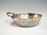 a silver bowl that is sitting on a table