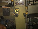 a machine that is sitting in a room with a lot of tools