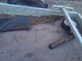 a tire that has been chained to the side of a truck