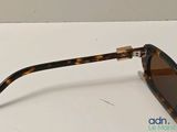 the sunglasses are made of tortoises and have brown lenses