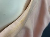 a close up of a woman ' s breast with a piece of fabric on it