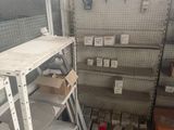 many shelves in a store that have various items on them