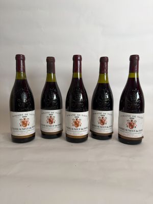six bottles of wine are lined up on a table