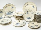 a lot of plates that are sitting on a table