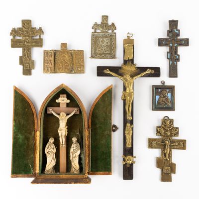 many religious items displayed on a white surface
