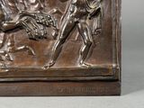 a bronze sculpture of a man and a dog