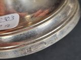 a silver plate that has a price tag on it