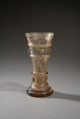 a glass vase that is sitting on a table
