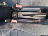a close up of a car seat with a remote control