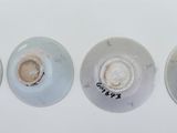 three different types of buttons on a white surface