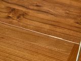 a close up of a wooden floor with a metal pole