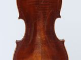 an antique violin with a wooden back and bow