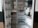 an open refrigerator that is sitting on a pallet