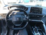 the interior of a car with a steering wheel and dashboard controls