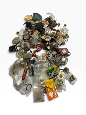 a pile of assorted items sitting on a white surface