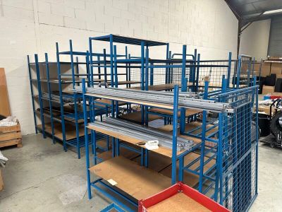 many shelves that are in a warehouse with boxes