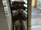 a stack of towels on a rack in a room