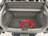 a red hose in the trunk of a car