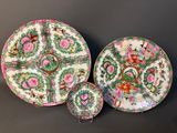 two chinese famille plates and a saucer