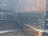 an image of a truck with a wooden bench in the back