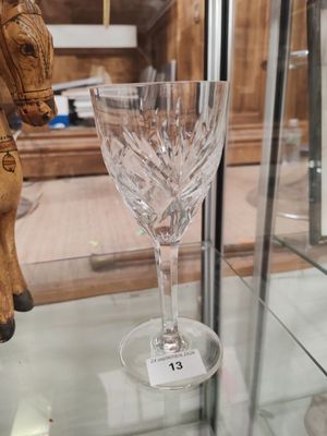 a glass with a horse on it and a wine glass with a horse on it