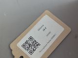 a tag attached to the back of a laptop computer