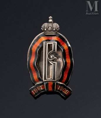 an image of a badge with a crown on top of a black background
