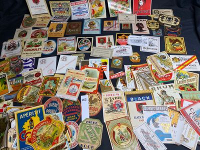 many different types of beer labels on a table