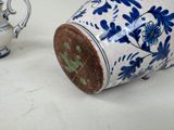 two vases sitting next to each other on a table