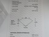 a receipt with a diamond on it sitting on a table