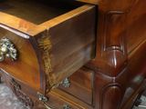 a wooden desk with a drawer on top of it