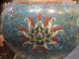 a blue vase with a floral design on it