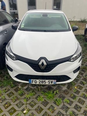 two cars parked next to each other in front of a building