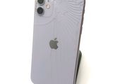 a close up of a white iphone with a broken screen